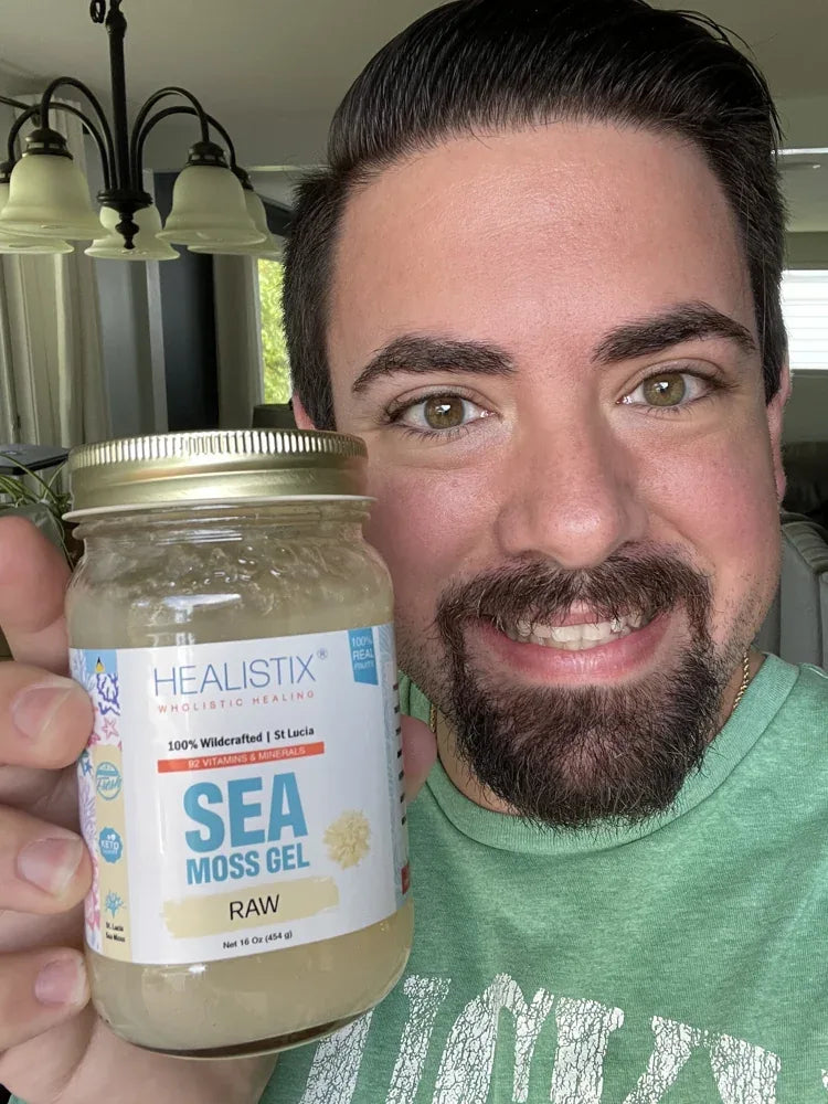Customer holding an Original sea moss gel jar
