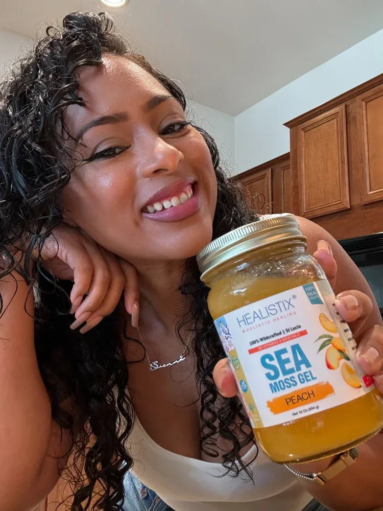 Customer holding a Peach sea moss gel jar