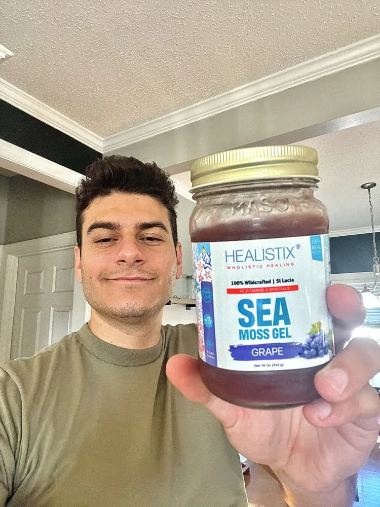 Customer holding a Grape sea moss gel jar