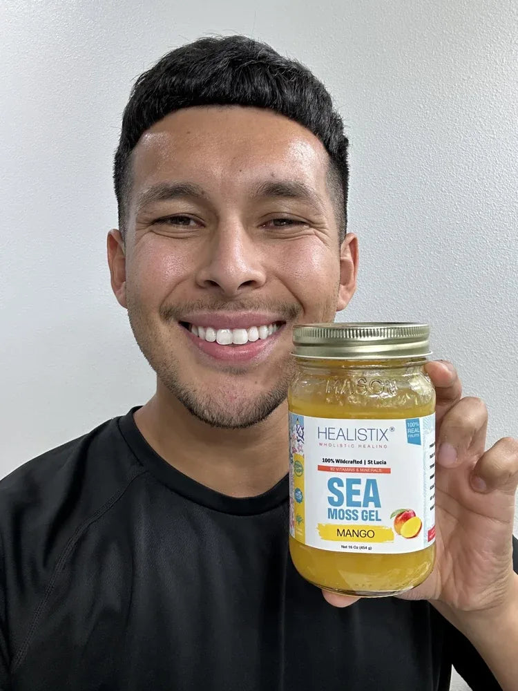 Customer smiling with a Mango sea moss gel jar